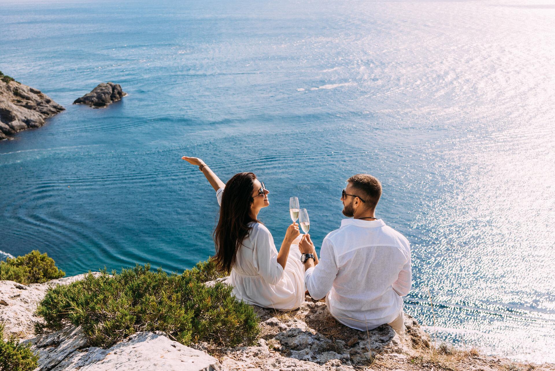 A couple in love celebrates their engagement on the seashore.